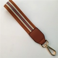 Brown woven wrist strap with red green stripe and gold lobster clasp for bags - Brown