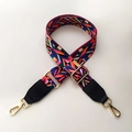 Detailed view of bohemian style colorful woven bag strap with golden metal hardware - Rainbow Style with Black Leather