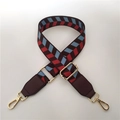 Close-up of retro plaid pattern wide strap with gold metal buckles and adjustable length - Brown
