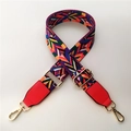 Macro detail of adjustable ethnic style woven strap with red leather ends and gold buckles - Rainbow Style with Red Leather