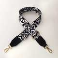 Detail of adjustable black and white geometric woven strap with gold metal swivel clasps - Black & White with Black Leather