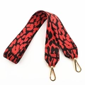 Detail of red and black leopard jacquard strap with polished gold lobster clasps - Red