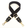 Detail of adjustable black cotton shoulder strap with gold-tone metal buckles and hooks - Black