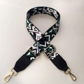 Detail of adjustable geometric patterned woven bag strap with gold lobster clasps - Black & Green with Black Leather