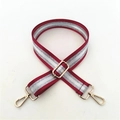 Close-up of adjustable red and silver sequin strap with gold lobster clasps and buckles - Burgundy