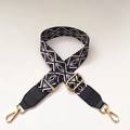 Detail of black and white geometric diamond pattern strap with gold metal swivel hooks - No.4 + Black Leather Trim