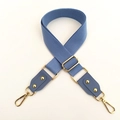 Detail of adjustable blue cotton strap with golden metal buckles and leather attachments - Lake Blue
