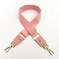 Close-up of pink cotton strap with adjustable gold metal buckle and leather ends - Silver Clasp / Pink
