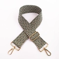 Detail of green and beige ethnic embroidery bag strap with gold metal swivel hooks - Green