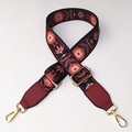 Close-up of ethnic floral embroidery on a wide adjustable shoulder strap with metal hooks - No.8 + Wine Red Leather Trim