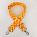Detail of adjustable wide shoulder strap with orange yellow geometric wave pattern and silver hooks - Orange & Yellow With Silver Buckle (A14)