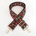Close-up of vintage floral embroidery on wide black adjustable strap with gold hooks - White Pink