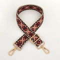 Detail of colorful jacquard guitar style bag strap with gold metal swivel hooks - Beige Orange Floral / Silver Clasp