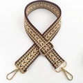 Dettaglio della tracolla larga regolabile in tela con motivo a onde e fibbie in oro - Motivo Ondulato Marrone Beige (#4) / Hardware Argentato