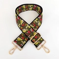 Close-up of ethnic floral embroidery on a wide adjustable shoulder strap with gold hooks - Little Red Flower