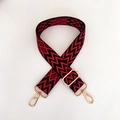 Close-up of red and black geometric embroidery bag strap with gold metal lobster clasps - Red Black with Gold Buckle