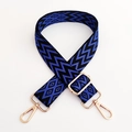 Detail of adjustable wide shoulder strap with blue geometric waves and gold metal hooks - Blue Black With Gold Buckle