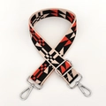 Detail of colorful woven shoulder strap with geometric ethnic pattern and metal clips - Orange Black Silver Buckle