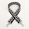 Close-up of adjustable wide fabric strap with black and white geometric triangle patterns - Black and White with Silver Buckle