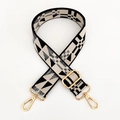 Dettaglio tracolla regolabile con motivo geometrico e ganci in metallo dorato - Beige Nero Fibbia Dorata