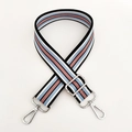 Close-up of adjustable striped canvas shoulder strap with silver lobster clasps - Light Blue Pink Stripe Silver Buckle