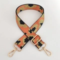 Detailed view of adjustable leopard print bag strap with gold metal lobster clasps - Orange Gold Line + Gold Buckle