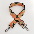 Close-up of leopard pattern woven strap with gunmetal hardware and adjustable buckle - Orange Gold Line + Gunmetal Buckle