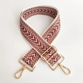 Macro detail of red and blue geometric woven wide strap with gold metal lobster clasps - Light Blue 1