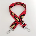 Detail of red leopard print woven bag strap with silver metal lobster clasps and buckles - Red Gold Thread + Silver Buckle