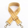 Detail of yellow and white geometric embroidery on thick adjustable wide bag strap - Yellow / Silver Clasp