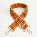 Detail of yellow ethnic embroidered bag strap with golden metal swivel hooks and thick weave - Yellow 1