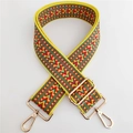 Detail of adjustable bohemian woven shoulder strap with geometric patterns and gold clips - Yellow 2