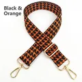 Detail of adjustable black and orange houndstooth strap with gold metal hooks - Black Orange