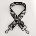 Macro shot of leopard print jacquard strap with adjustable gunmetal buckle and clips - Grey Silver Thread + Gunmetal Buckle