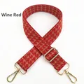 Detail of wine red houndstooth wide bag strap with adjustable gold hardware - Burgundy