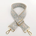 Close-up of paisley jacquard strap with gold-tone metal lobster clasps for bags - No.3 Cloud Blue