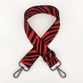 Close-up of red and black zebra pattern nylon replacement strap with gunmetal lobster clasps - Red With Gunmetal Buckle