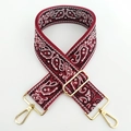 Close-up of red paisley embroidered wide bag strap with polished gold metal lobster clasps - No.14 Wine Red