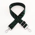 Detail of adjustable zebra pattern wide shoulder strap with silver lobster clasps - Green Webbing with Silver Buckle