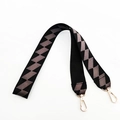 Close-up of wide woven bag strap with grey zigzag pattern and gold lobster clips - Black Long Style