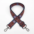 Close-up of ethnic embroidered bag strap with orange and blue floral patterns and metal hooks - Blue Orange with Gunmetal Buckle