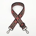 Detailed view of woven ethnic shoulder strap with red geometric pattern and metal hooks - Wine Red Gunmetal Buckle