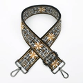 Close-up of yellow and white floral embroidery on a wide crossbody bag strap with metal hook - Light Brown (Gunmetal Buckle)
