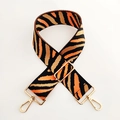 Close-up of wide zebra-pattern strap with high-density weave and gold lobster clasps - Silver Clasp / Bright Orange