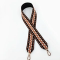 Close-up of ethnic geometric wavy pattern on woven wide replacement shoulder strap with gold clips - Black Light Brown