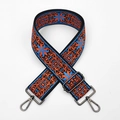 Close-up of ethnic floral embroidery on a wide bag strap with gunmetal black hooks - Blue Chrysanthemum (Gunmetal Buckle)