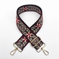 Close-up of bohemian embroidered bag strap with gold metal lobster hooks and slider - Burgundy