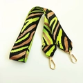 Detail of colorful zebra print nylon shoulder strap with golden metal lobster clasps - Fluorescent Green