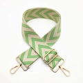 Adjustable woven purse strap in beige and green V-pattern with gold metal hardware - Bright Green