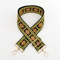 Detailed macro view of ethnic geometric jacquard bag strap with gold metal buckles - L-Yellow